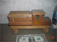 Wooden truck with Bible verses on logs