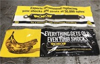 Two Monroe Shocks garage banners
