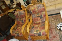 Pair cane armchairs with cushions.