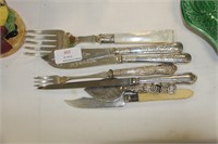 Silver plated cutlery,some with silver collars.