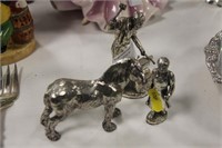 Silver plated blacksmith and horse figures.