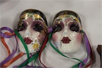 Pair signed hand painted wall masks.