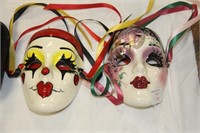 2 hand painted, signed wall masks.
