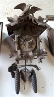 Cuckoo clock with weights and pendulum