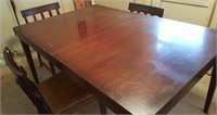 Dining room table with built-in leaf and 4 chairs