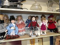 COLLECTIBLE HERITAGE MINT PORCELAIN DOLLS AND STAS