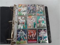 binder full of assorted sports cards