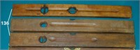 Three 28-inch wooden levels