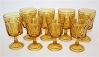 Eight Stemmed Amber Glass Goblets