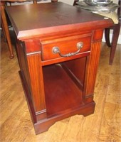 Winners Only wood end table with single drawer.