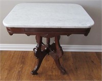 Antique marble top stand with wood carving