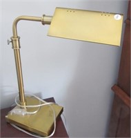 Adjustable desk lamp. Measures: 20" Tall.
