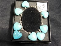 Eight Turquoise hearts making a bracelet - market