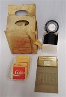 Coca-Cola Coasters, Clipboard, and Cardboard Box