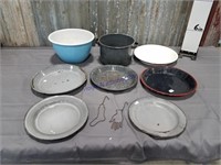 Assorted enamel pots, pans, and lids