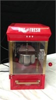 Hot and fresh popcorn maker powers on