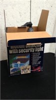Motion detector with security light