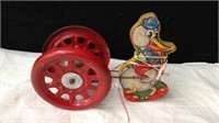 Vintage metal bell pull toy with wooden duck