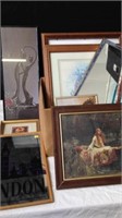 Group of framed artwork and mirrors