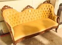 Victorian tufted settee w/repair to carved