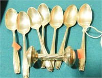 (7) sterling spoons and (1) sterling baby rattle