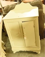 Diminutive white painted two door cabinet