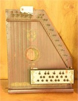 Primitive wooden stringed instrument