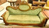 Empire tufted sofa with carved crest