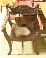 Antique wooden carved arm chair with North