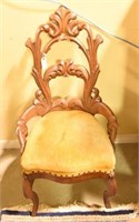 Highly carved Victorian Walnut upholstered