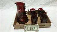 Red cut glass pitcher and vases