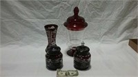 Red glass vase and 3 covered jars