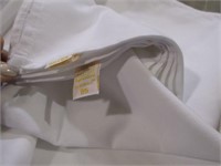 White flat sheets and assorted color cloth napkins