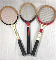 Three vintage tennis rackets