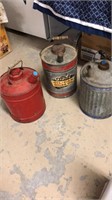 3 medium size oil cans.
