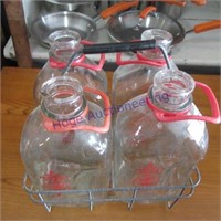 4 milk bottles in wire carrier