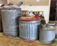 Three metal gas cans