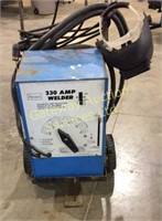 Sears 230 amp welder on cart with wheels and has