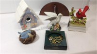 Assorted bird collection including birdhouse