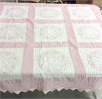 Pink and white quilt