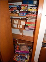 Closet lot of board games and artist postcards
