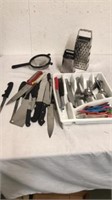 Group of kitchen utensils and shredder