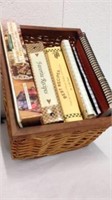 Collection of recipe books in wicker basket