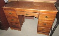 Wood desk with seven drawers. Measures 30" h x