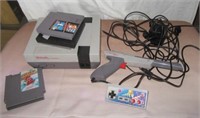 Nintendo entertainment system with games and gun