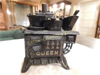 mini cast iron stove w pots, by Queen