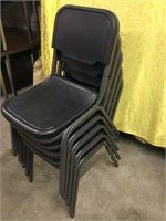 Five Black Plastic Chairs