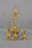 Four East Indian Brass Decanters