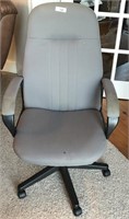 Grey office chair with rollers