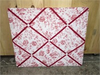 Peg Board flopral with red ribbon